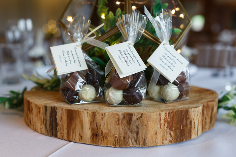 Bags of truffles with personalised labels for a wedding